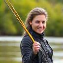 Rikke Yueill holding a fly rod